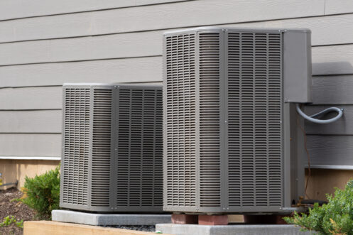 Two AC units in the backyard of a Foothill Ranch home